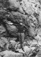 Webster Thayer leaning against a rock