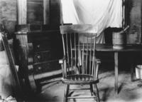 M.O. Howe's house interior with rocking chair and bureau, Newfane, Vt.
