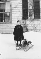 Unidentified girl with sled and teddy bear