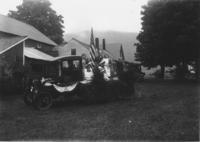 Webster Thayer driving parade wagon with Doris Stone and Virginia Stratton