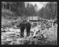 Herm Powers and Mr. Goodell in front of a bridge, Williamsville, Vt.