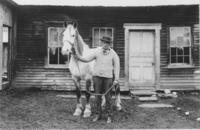 Hubert Brown with his horse, in front of his house, South Newfane, Vt.