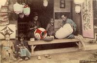A lantern maker and his family plying their trade